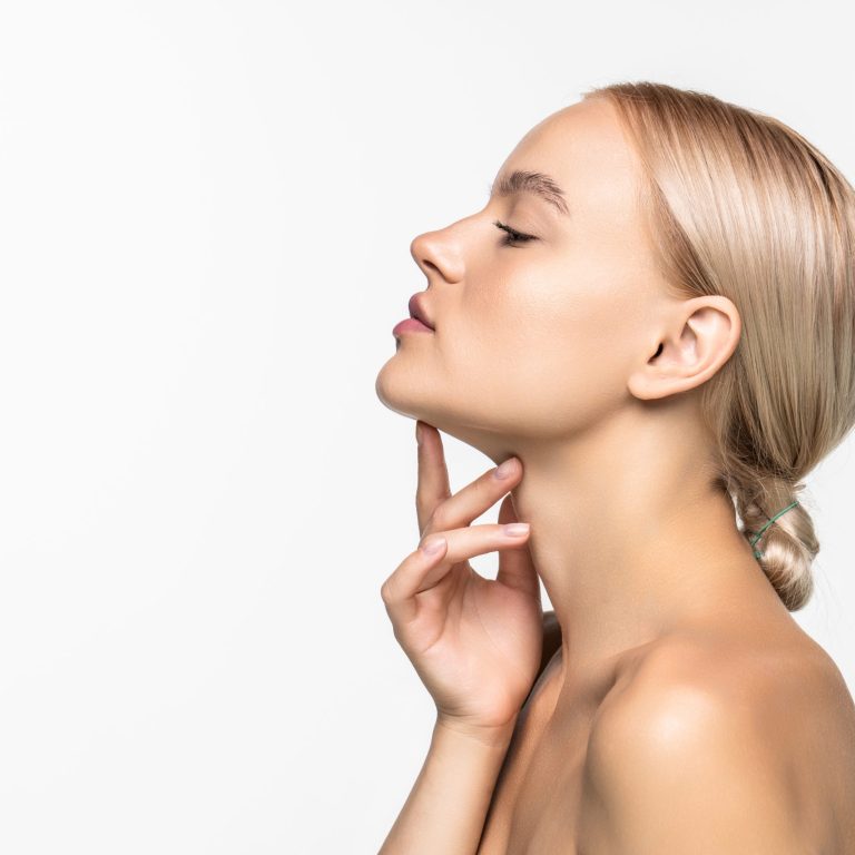 Beautiful young girl touching her face. Youth and skin care concept